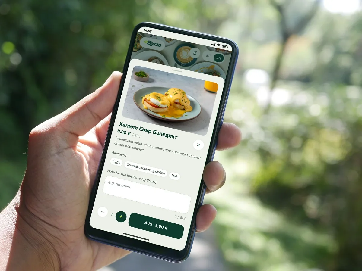 A hand holding a phone with a dish from a demo restaurant’s menu: photo, portion size and price